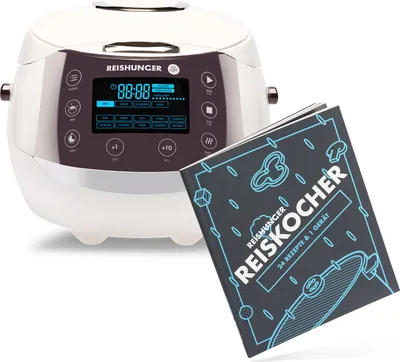 A white rice cooker and a recipe book displayed together.