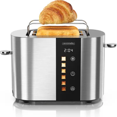 A silver toaster with a croissant and toast on a white background.