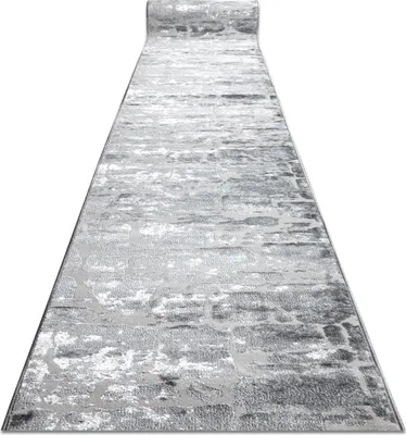 A long runner rug is shown from a diagonal perspective, unrolled on a white background.