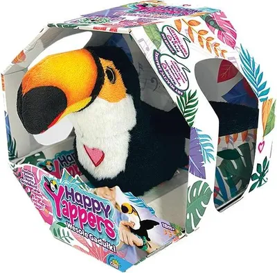 A plush toucan toy inside its retail packaging, which is decorated with tropical leaves and product branding.