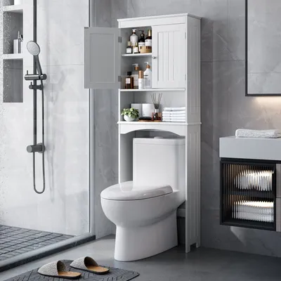 A bathroom scene with a toilet and a white cabinet.