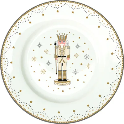 A white plate with a nutcracker design and festive border.