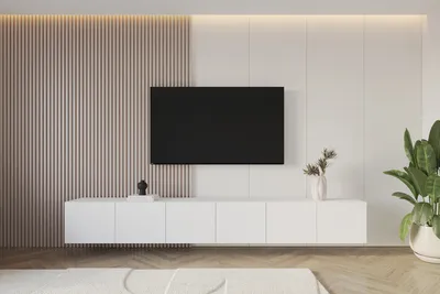 A modern living room with a wall-mounted TV and media console.