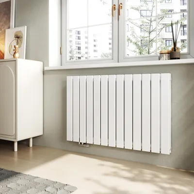 A modern living room with a white radiator under a window.