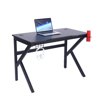 A gaming desk with a laptop, headphones, and a cup holder.