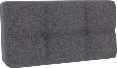 A dark gray tufted cushion for a pallet sofa.