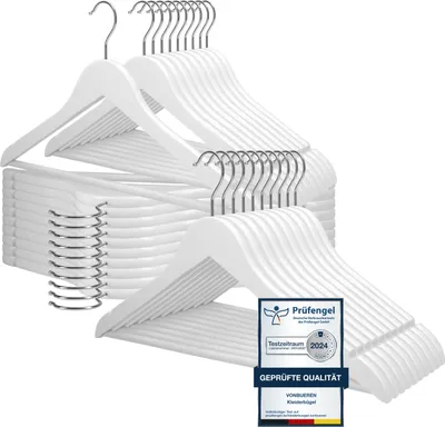A stack of white wooden hangers with silver hooks, displayed against a white background. A quality seal is overlaid on the bottom right.