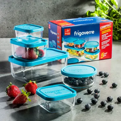 A product shot of Bormioli Rocco Frigoverre food storage containers, with a box in the background and some fruit in the foreground.