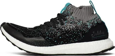 A side view of an Adidas Ultra Boost Mid S.E. sneaker.