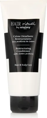 A white tube of hair conditioner with a black label.