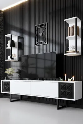 A modern living room setup with a TV stand, television, and wall decor.