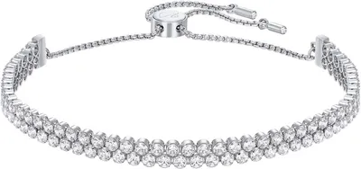 A close-up studio shot of a diamond tennis bracelet.