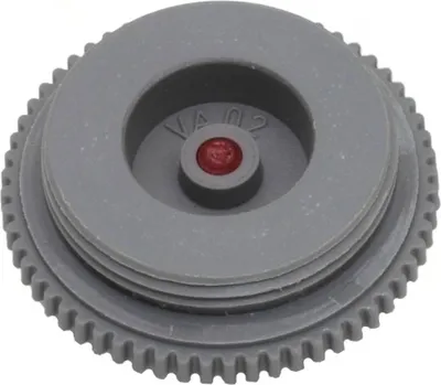 A close-up, isolated shot of a gray plastic valve fitting with a red insert.