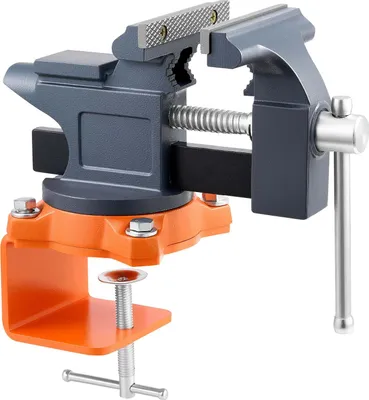 A close-up studio shot of a bench vise with an orange clamp base.