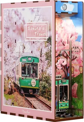 A diorama-style product depicting a train traveling through a cherry blossom forest, with a smaller train model on the side.