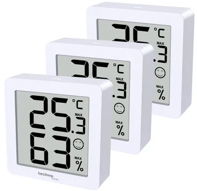 Three white digital thermo-hygrometers are arranged diagonally on a white background.
