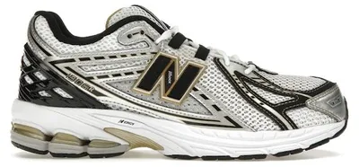 Immagine prodotto di New Balance 1906R, colore bianco con dettagli dorati (taglia per ragazzi/e) - EU 40