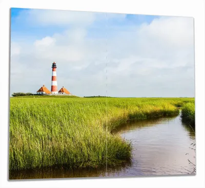 Produktbild von Wallario Herdabdeckplatte aus Glas, Größe 60 x 52 cm 2-teilig, Motiv Kleiner Bach durch Schilf auf dem Weg zum Leuchtturm