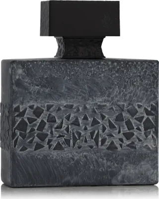 A perfume bottle with a textured gray body and a black cap.