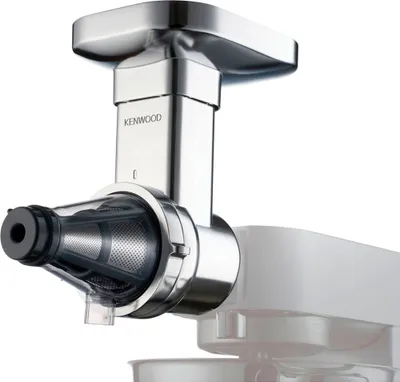 A close-up studio shot of a Kenwood juicer attachment connected to a stand mixer.