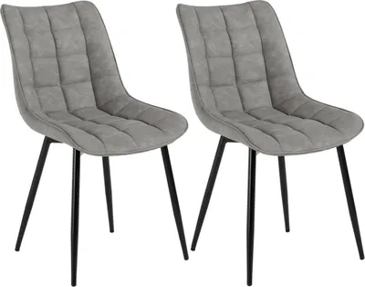 Two gray upholstered dining chairs with black metal legs against a white background.