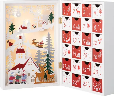 An open advent calendar with a Christmas village scene inside and numbered drawers on the right.