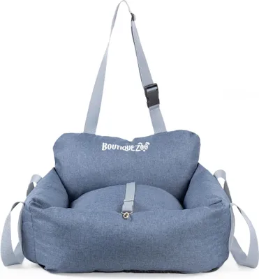 A blue dog car seat with straps and a logo.