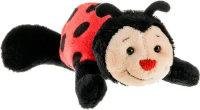 A plush ladybug toy lying on a white background.