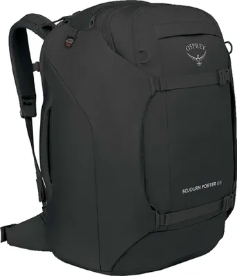 A black Osprey Sojourn Porter 65 rucksack is shown from a diagonal front view against a white background.