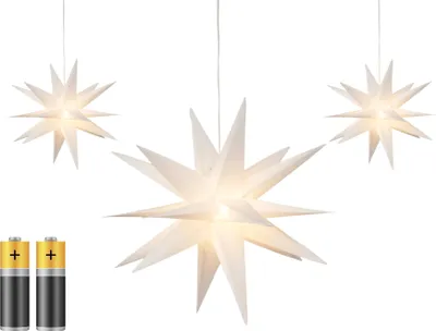 Three white star-shaped lanterns are displayed against a white background. Two AA batteries are shown in the lower-left corner.