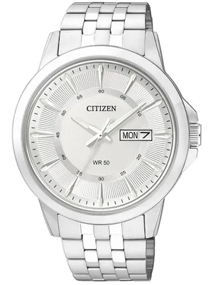 A close-up studio shot of a silver Citizen watch with a white dial.