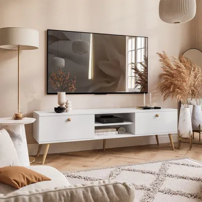 A modern living room scene featuring a white TV stand with a television mounted above it.