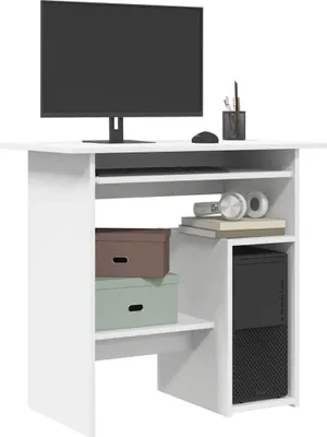 A white desk with a computer monitor, keyboard, mouse, headphones, and storage boxes.