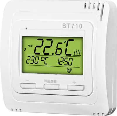 A white digital thermostat with a green LCD screen displaying temperature and time.