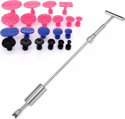 A set of car dent repair tools, including various suction cups and a pulling tool, laid out on a white background.