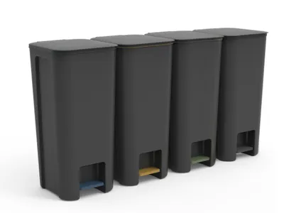 Four black trash cans with colored pedals lined up against a white background.