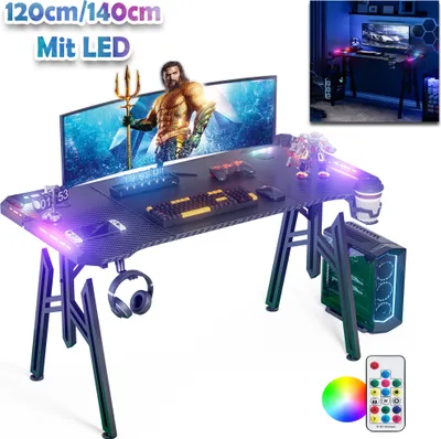 A gaming desk setup with a computer, monitor, keyboard, mouse, and headphones, all illuminated by LED lights.