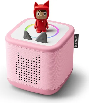 A pink Toniebox starter set with a red character figurine on top.