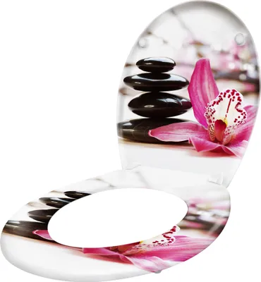 A toilet seat with a decorative print of stacked stones and a pink orchid.