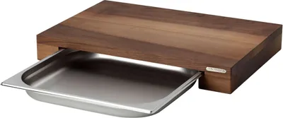 A wooden cutting board with a stainless steel drawer pulled out.