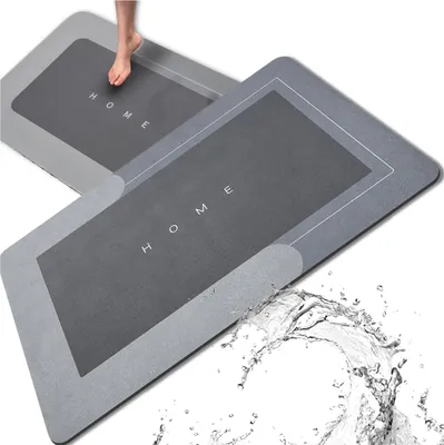 Two gray bath mats, one with a foot on it, and water splashing.