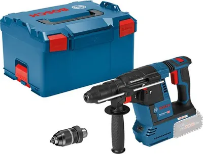 A Bosch rotary hammer drill with its case and an accessory.