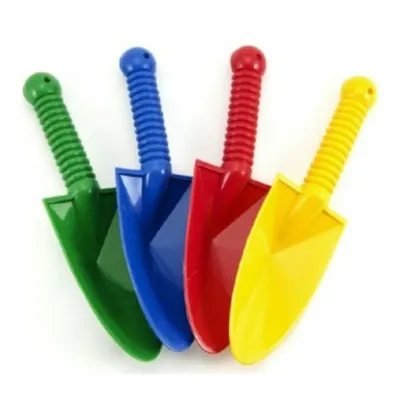 Four colorful plastic toy shovels are lined up against a white background.