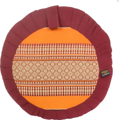 A round cushion with a decorative pattern.