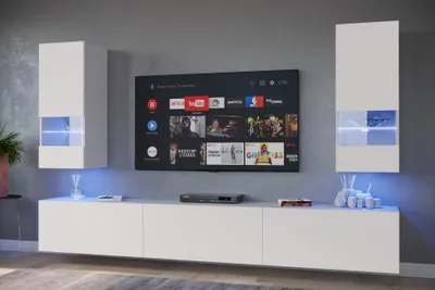A modern living room setup with a wall-mounted TV and entertainment unit.