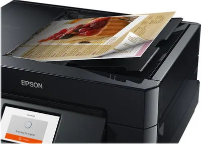 A close-up view of an Epson printer scanning a document.