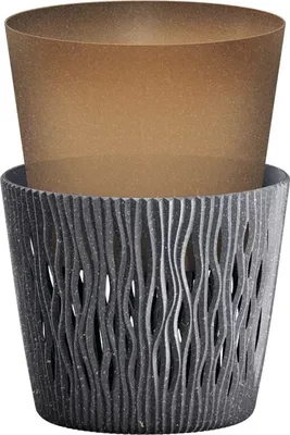 A brown planter pot is placed inside a gray decorative outer pot.