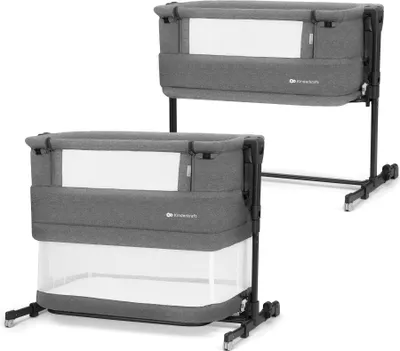 Two grey baby cribs are shown against a white background. The cribs are identical and appear to be the same model.