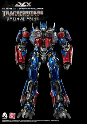 A full-body shot of an Optimus Prime action figure against a black background.