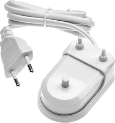 A white electric toothbrush charging station with a white power cord and plug.